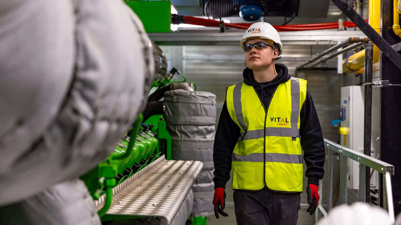 An engineer checks a linear rail assembly during a final quality inspection.