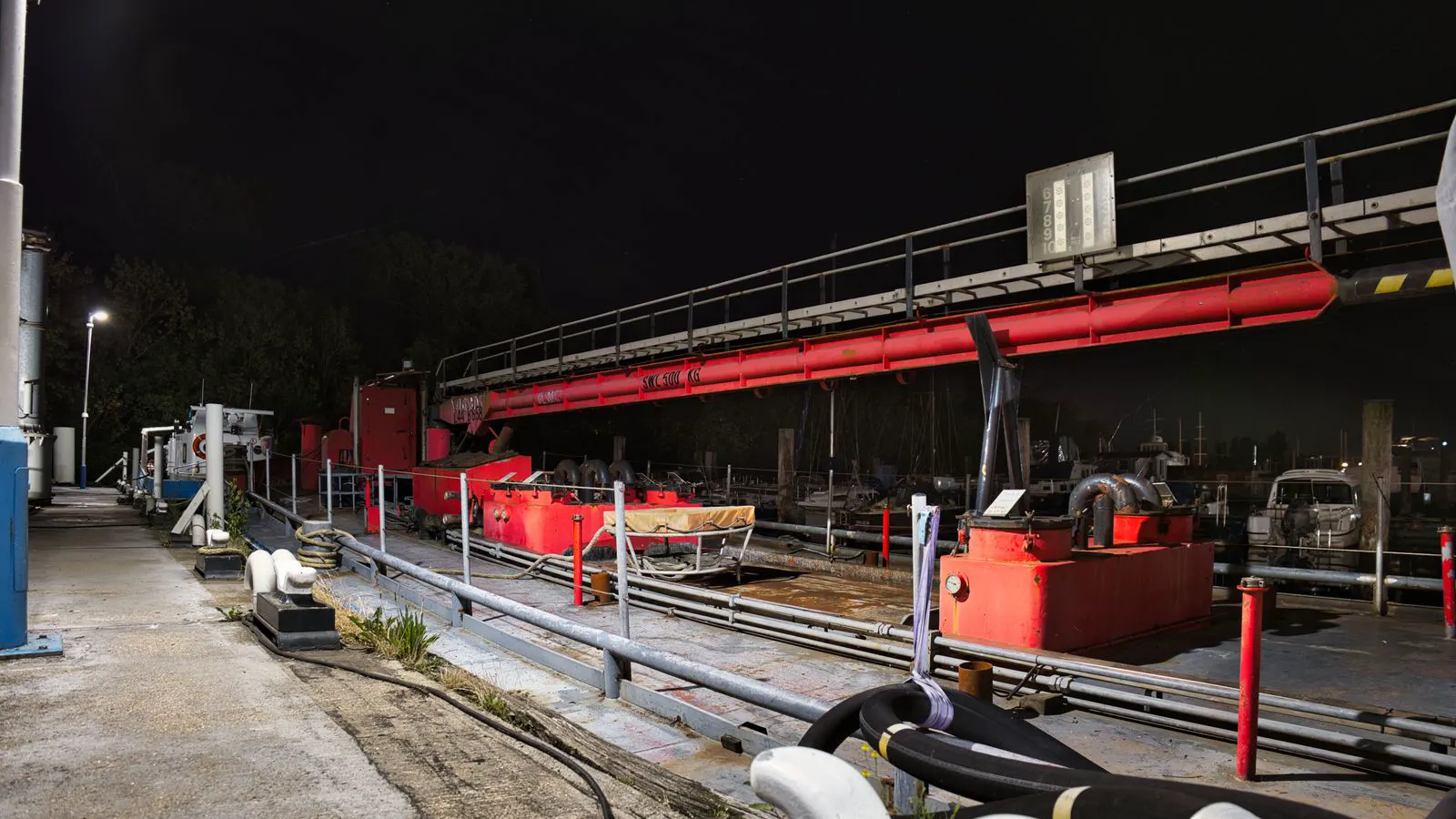 A large industrial hydraulic pump with visible port connections