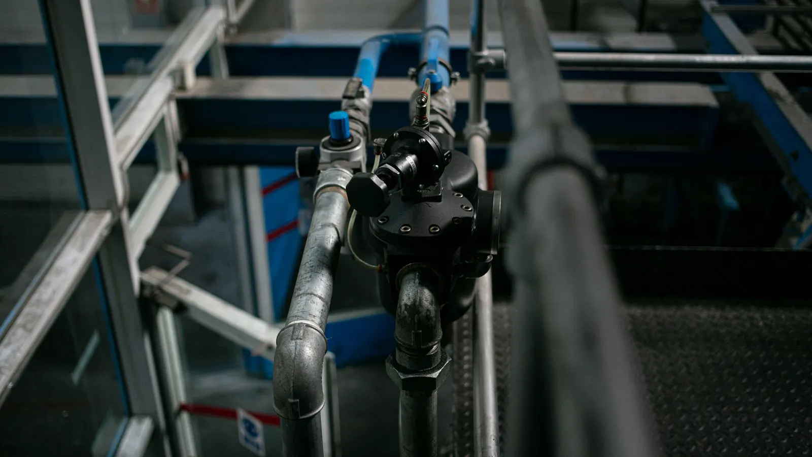 A pressure relief valve mounted on a steel hydraulic manifold