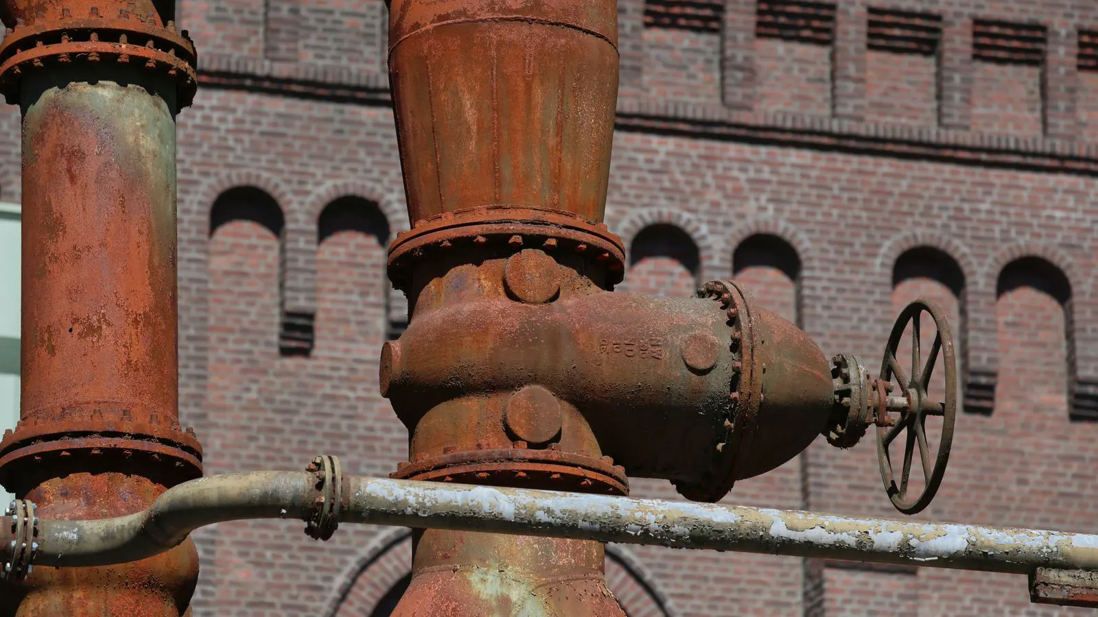 A stainless steel control valve with actuator installed on a process pipe