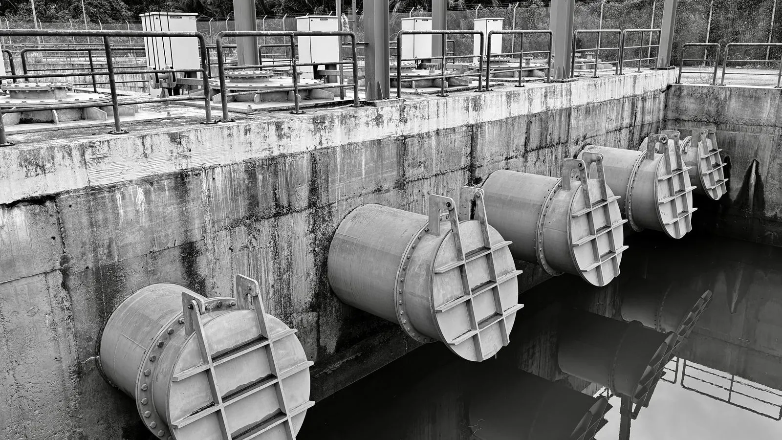 Close up view of industrial valves installed on heavy steel piping