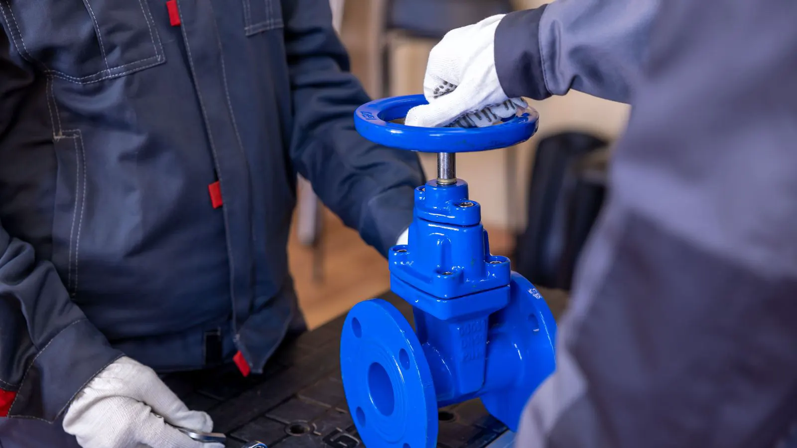 A manual override valve actuator installed on an outdoor pipe