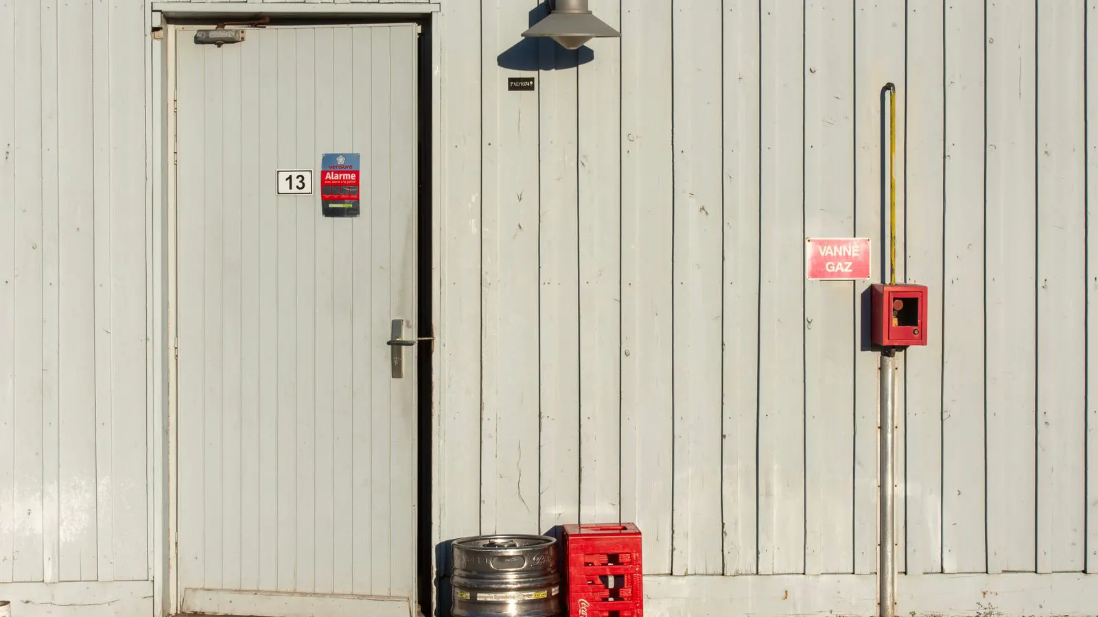 A stainless steel valve undergoing pressure testing in a workshop.