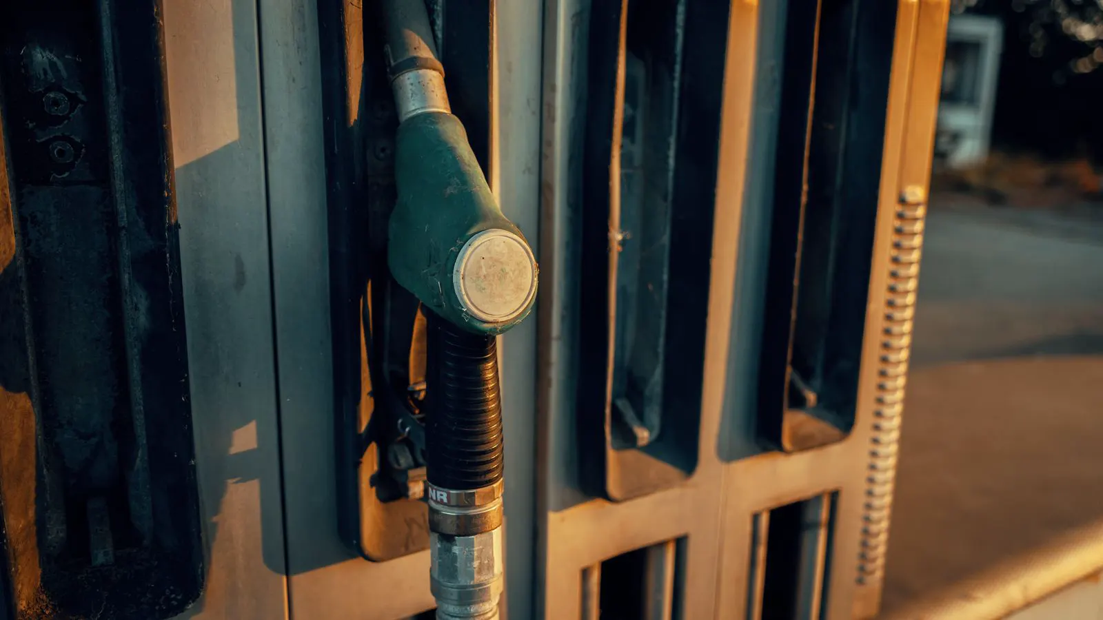 Stainless steel pump connected to a network of industrial pipes