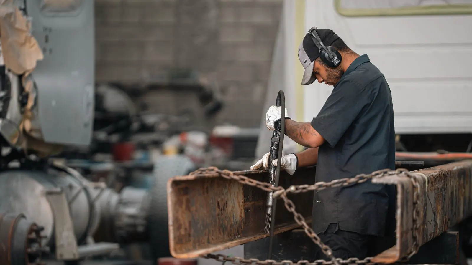 Technician checking vibration on an industrial pump