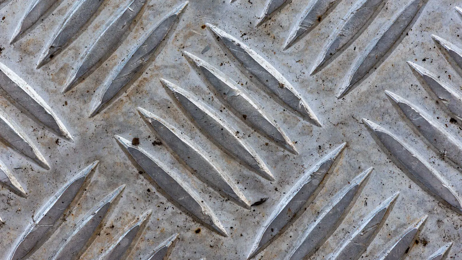 Close-up view of a rivet head on a metal surface