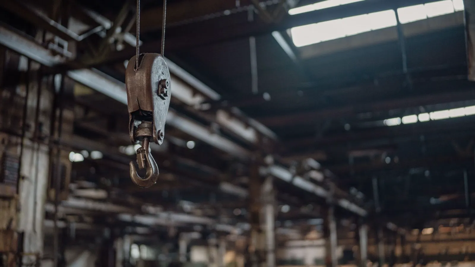 A storage rack filled with steel bolts and washers in a warehouse