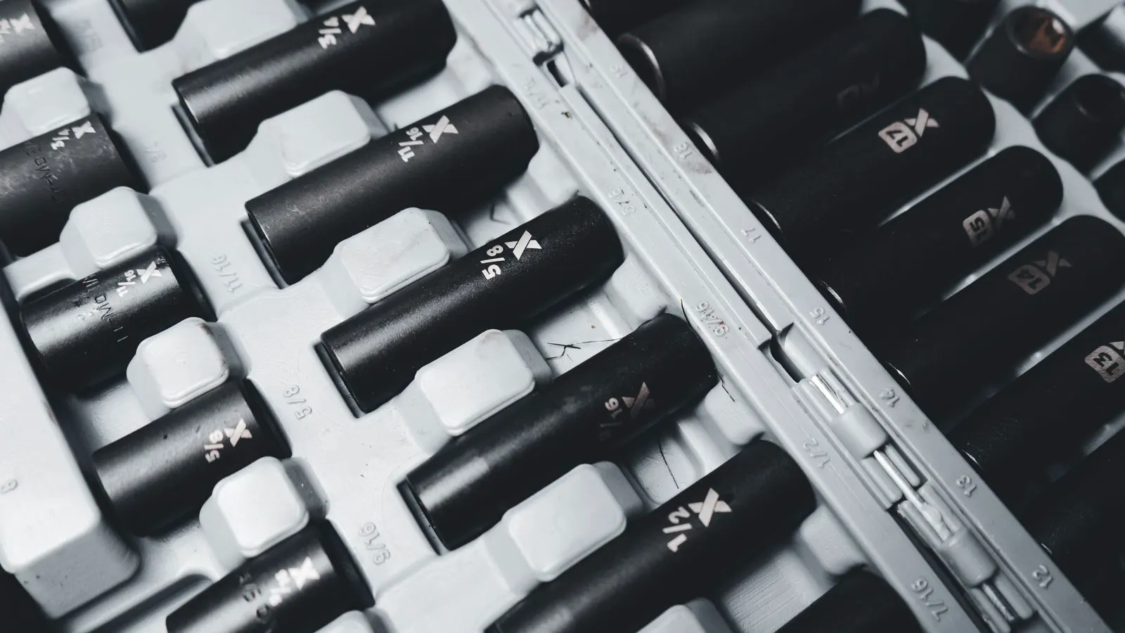 A close up of two hex bolts showing different head shapes.