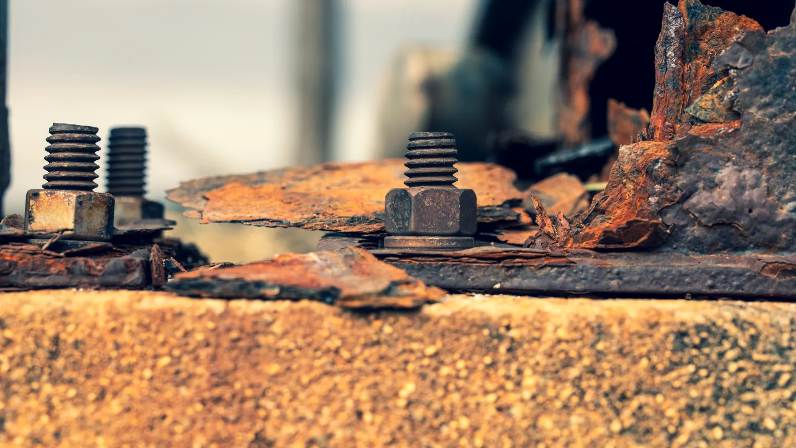 A close up of steel hex bolts and washers on a warehouse shelf