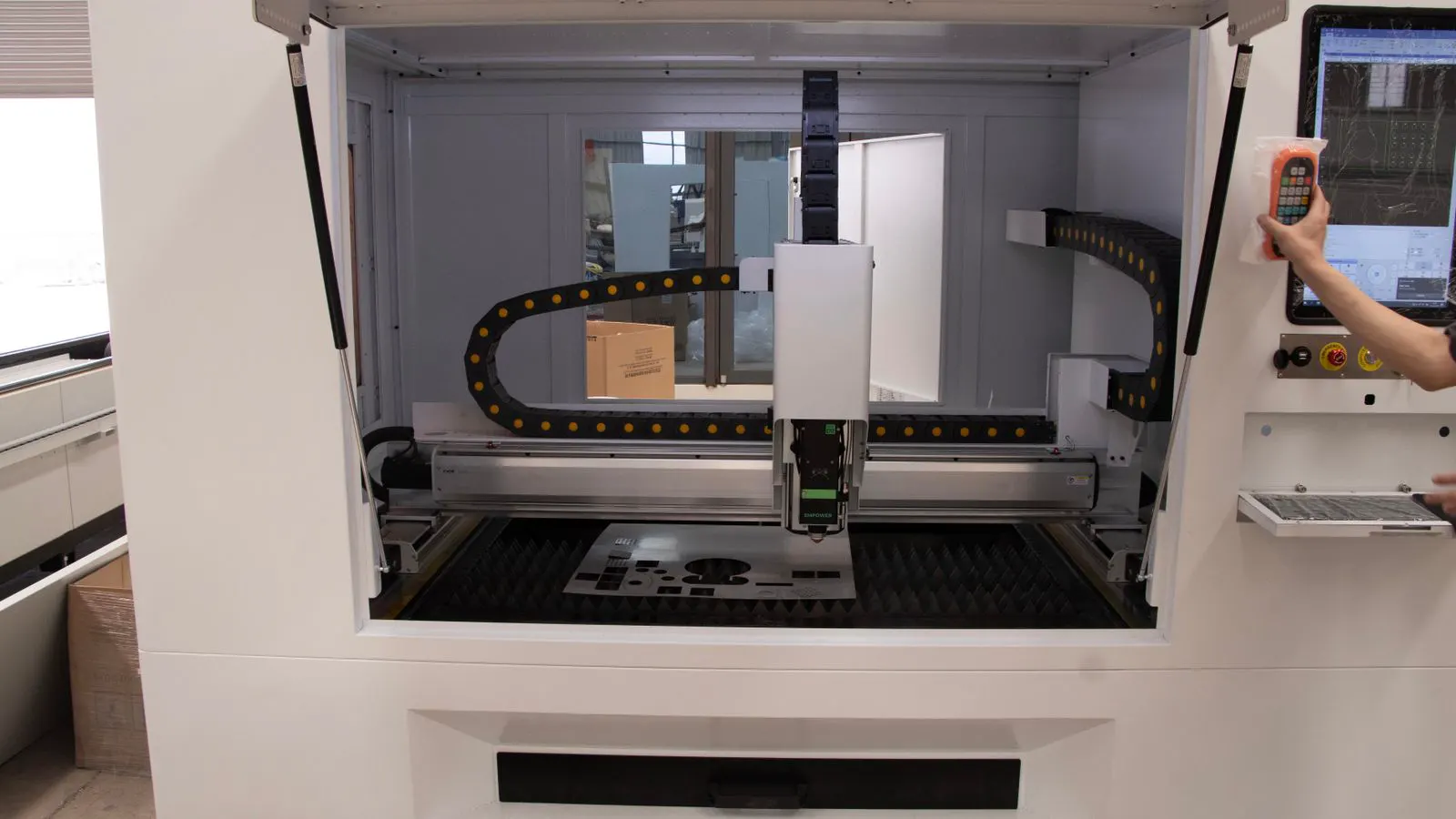 A technician inspecting a CNC machine spindle assembly for alignment