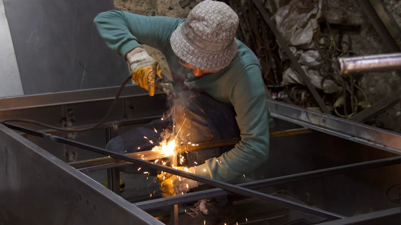 A fume extraction arm positioned near a welding station