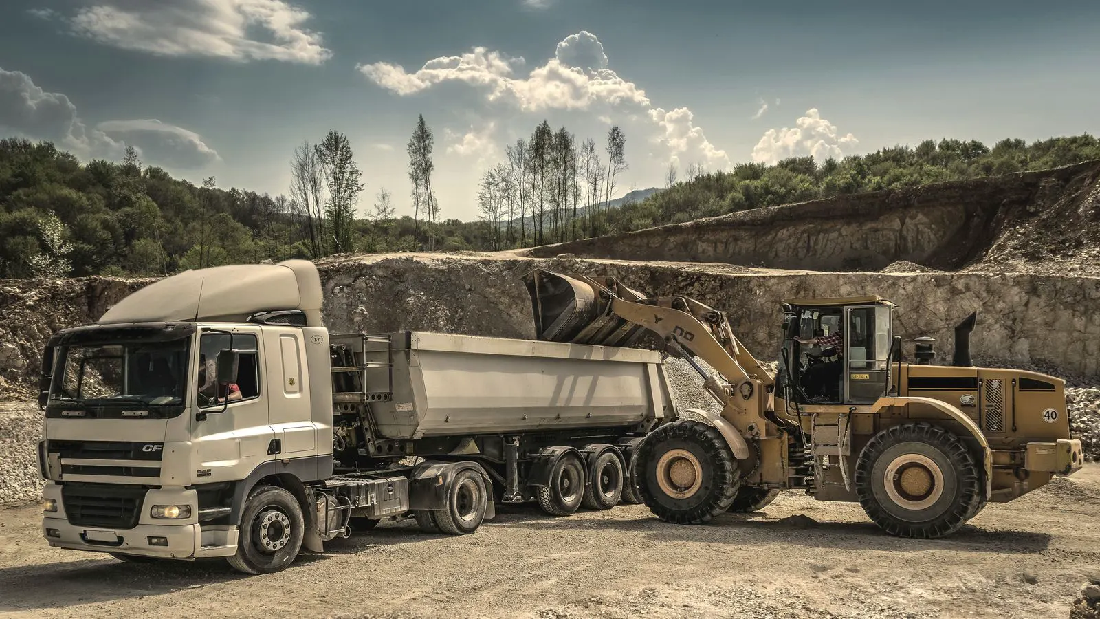 Large off-highway haul truck parked near a loading pit