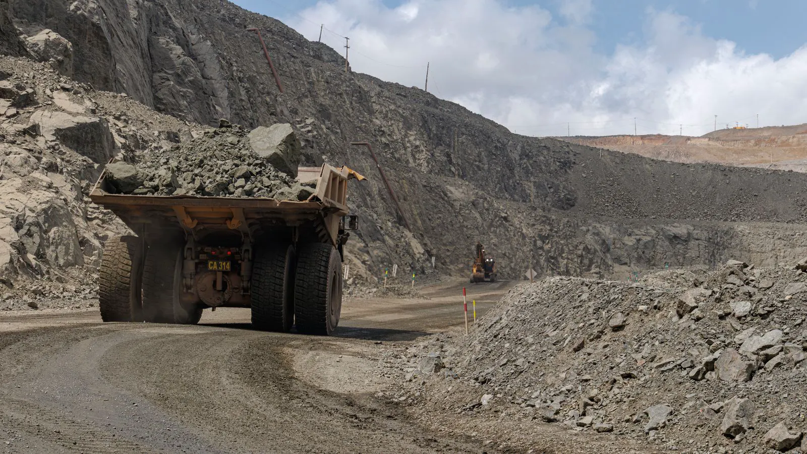 Large haul truck carrying ore on a mine site