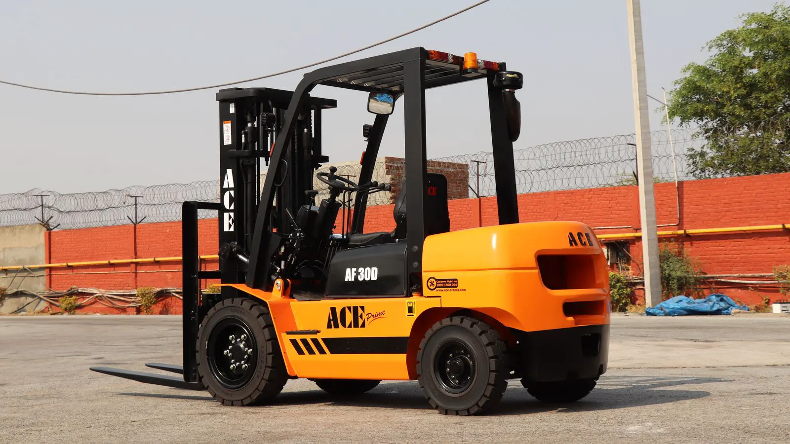 Technician checking fuel lines on a diesel powered forklift