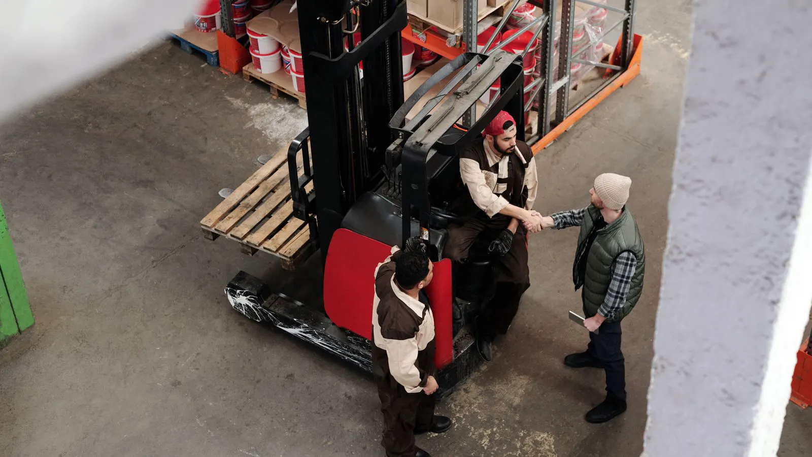 A forklift chassis and battery pack in a modern warehouse
