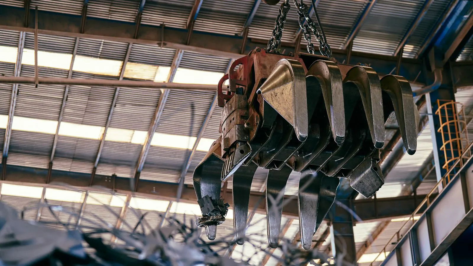 A large steel gantry crane structure spanning a warehouse aisle.