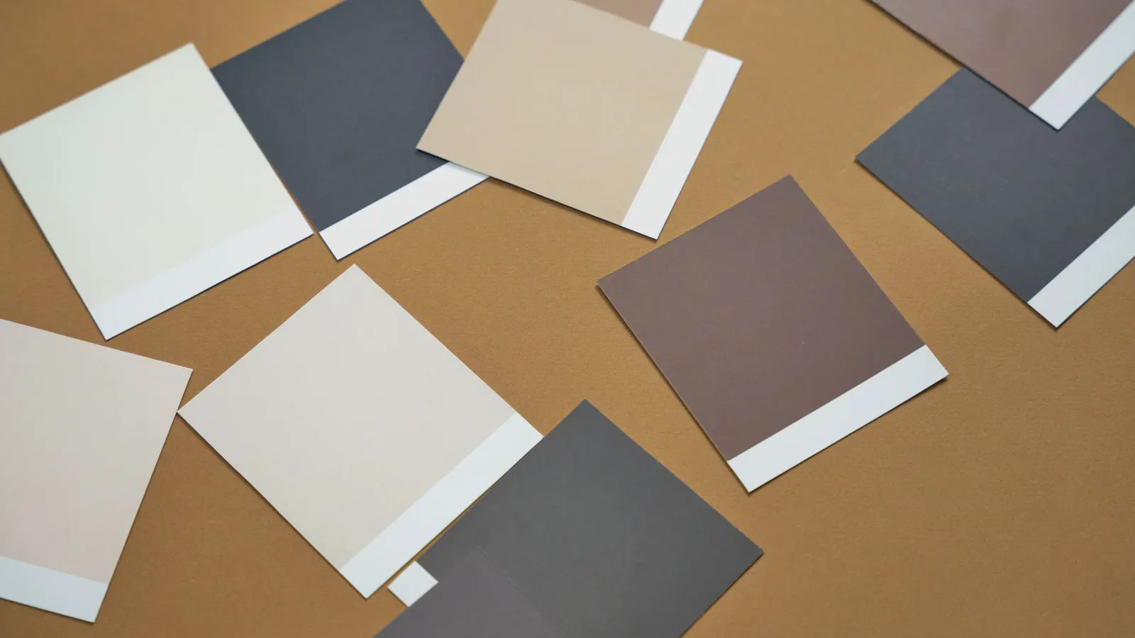 A row of metal panels showing different powder coating colors