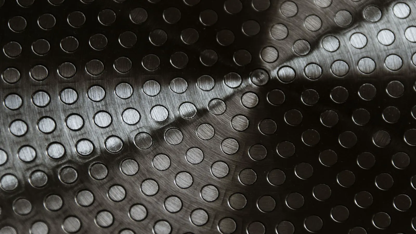 Metal parts resting on a workbench during quality inspection
