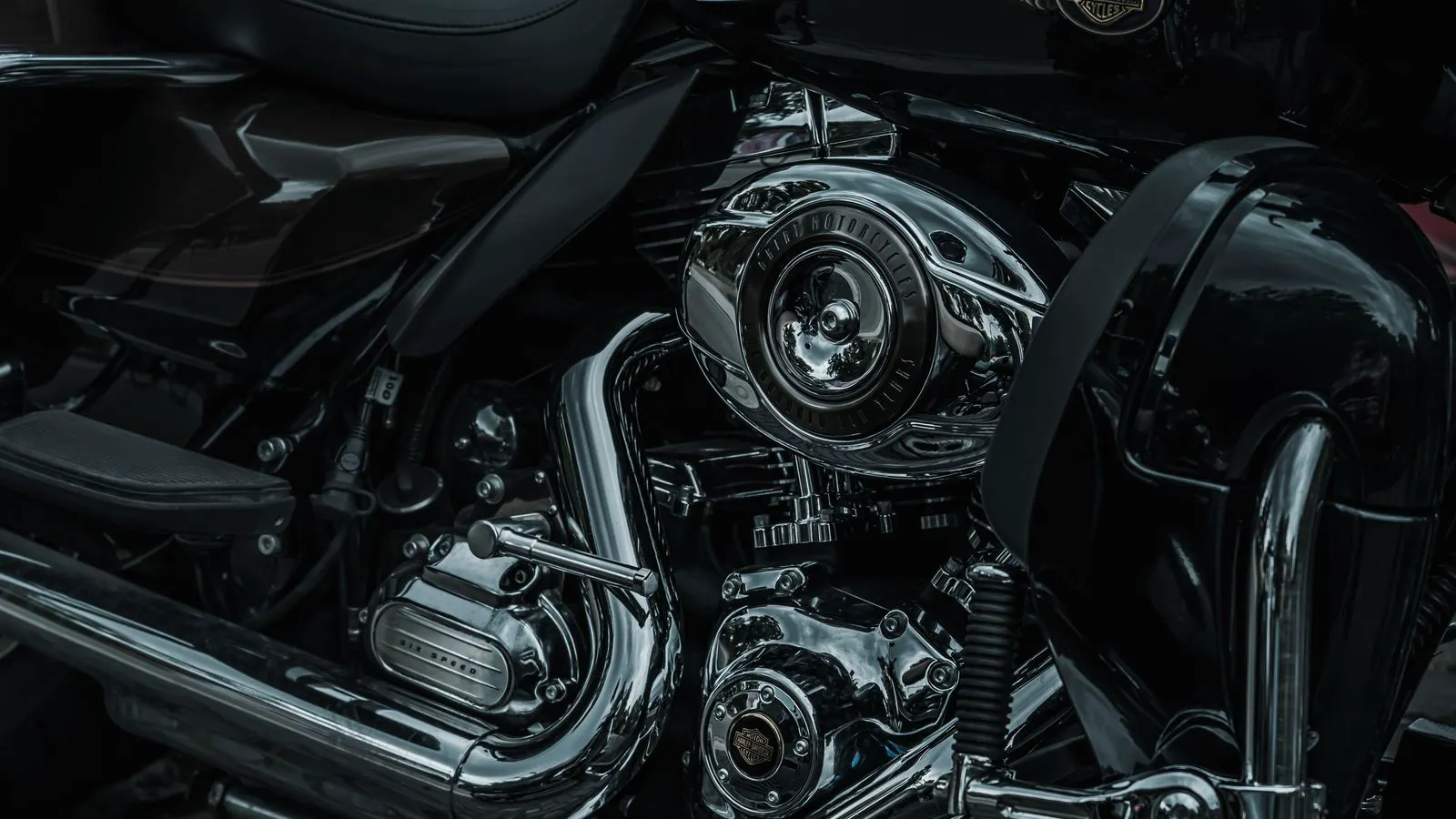 Close up of shiny chrome and matte stainless metal components side by side.