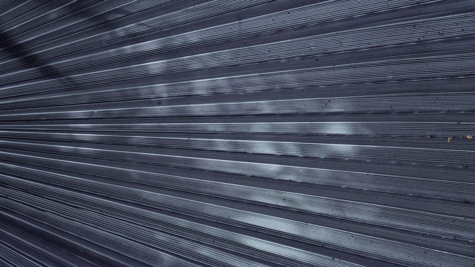 A digital profilometer measuring the texture of a blasted steel plate