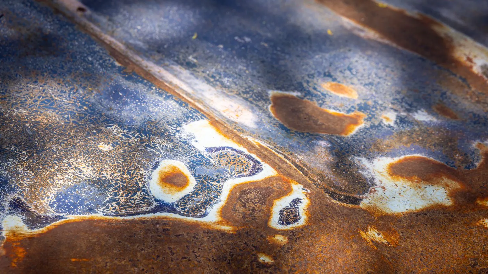 Aluminum components submerged in an anodizing solution