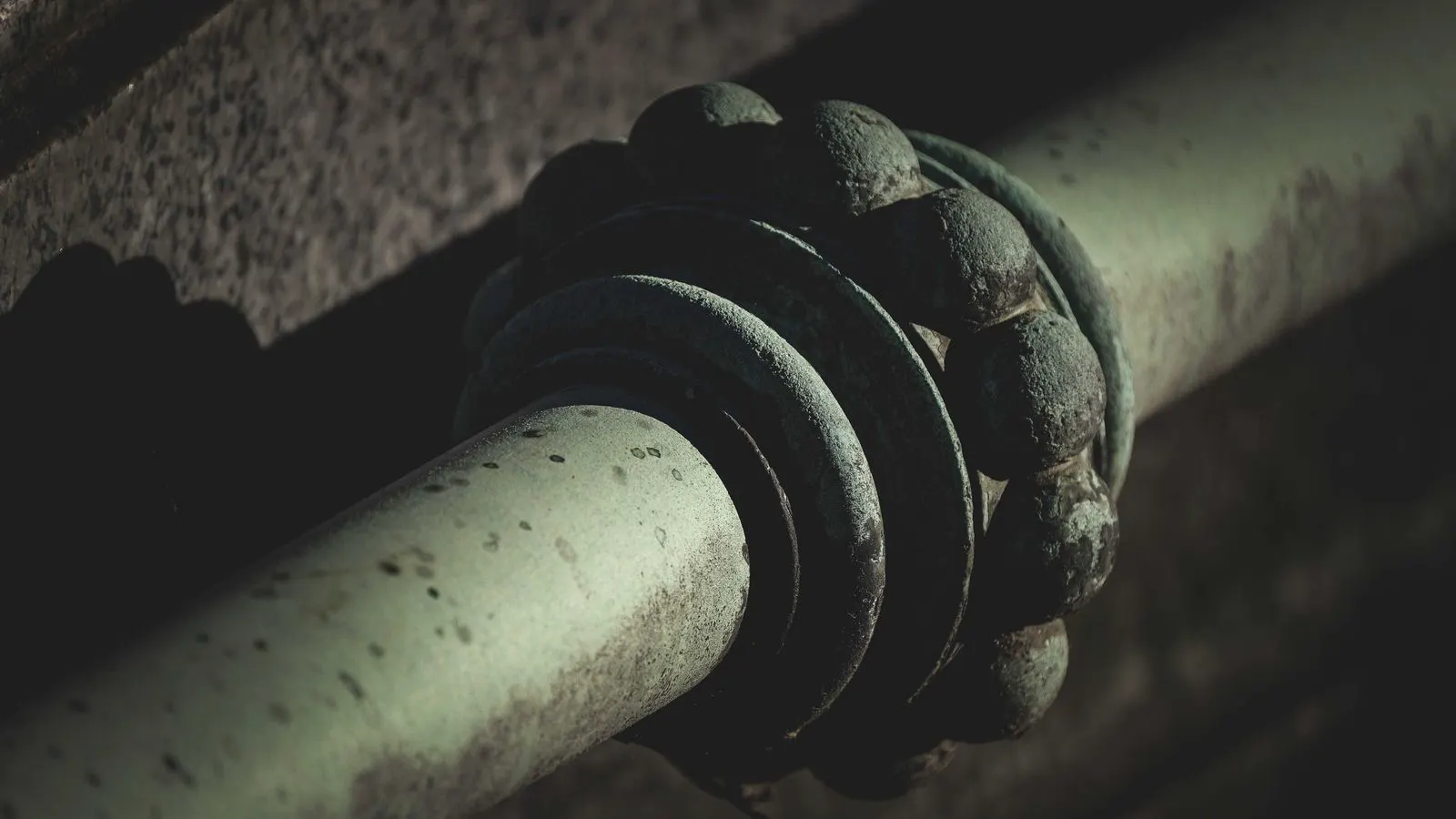 A coated metal part after salt spray testing showing corrosion