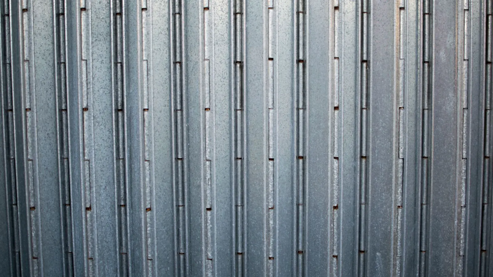 Aluminum and steel parts showing different surface finishing treatments