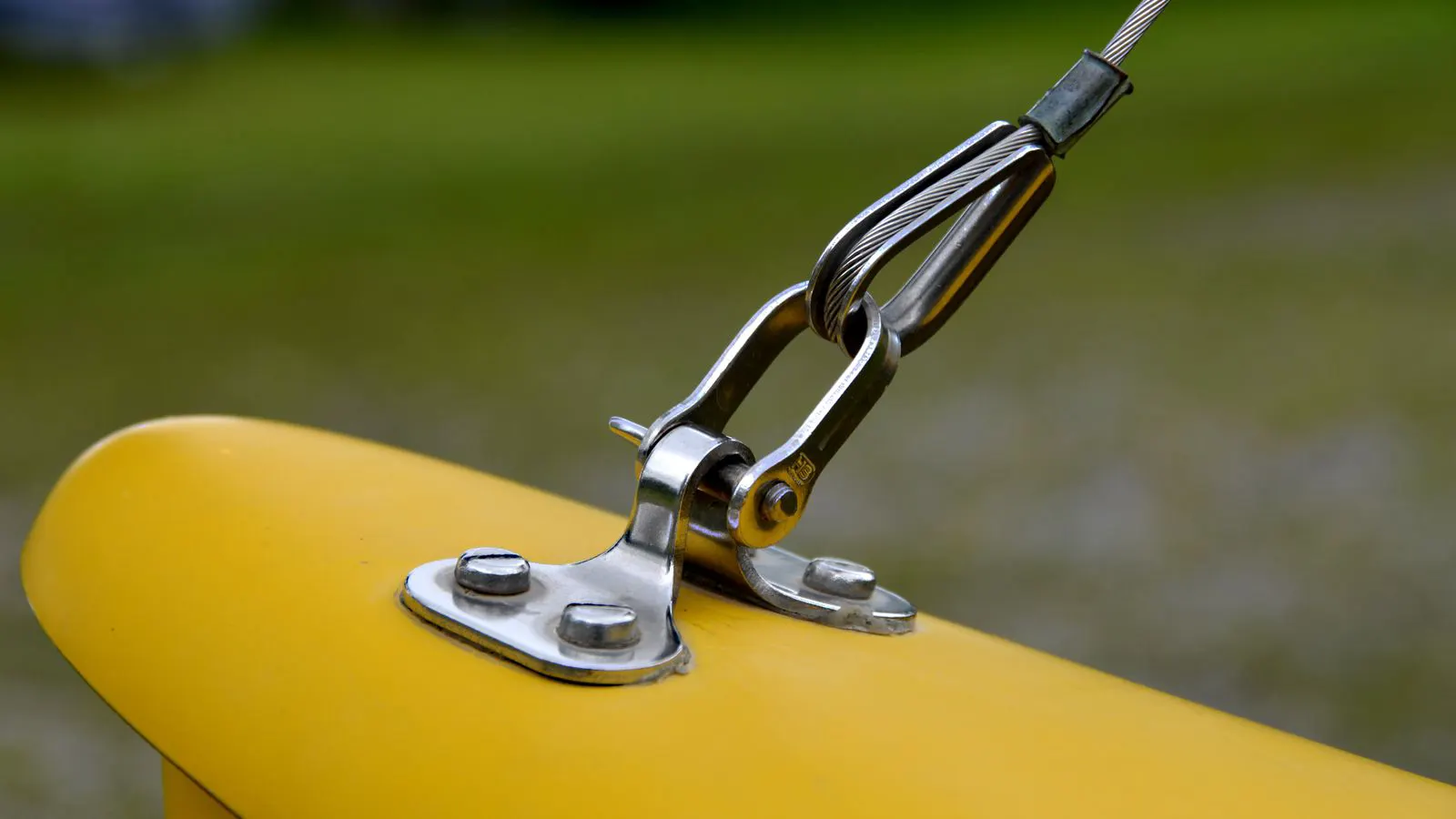 Stainless steel component with a uniform surface finish under a bright light source.