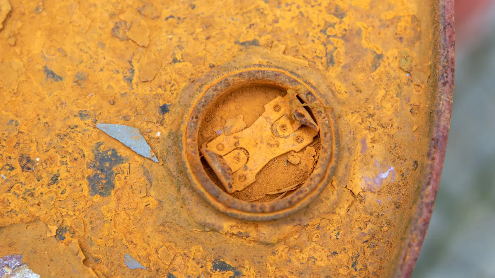 Metal surface with raised texture from uneven powder coating cure