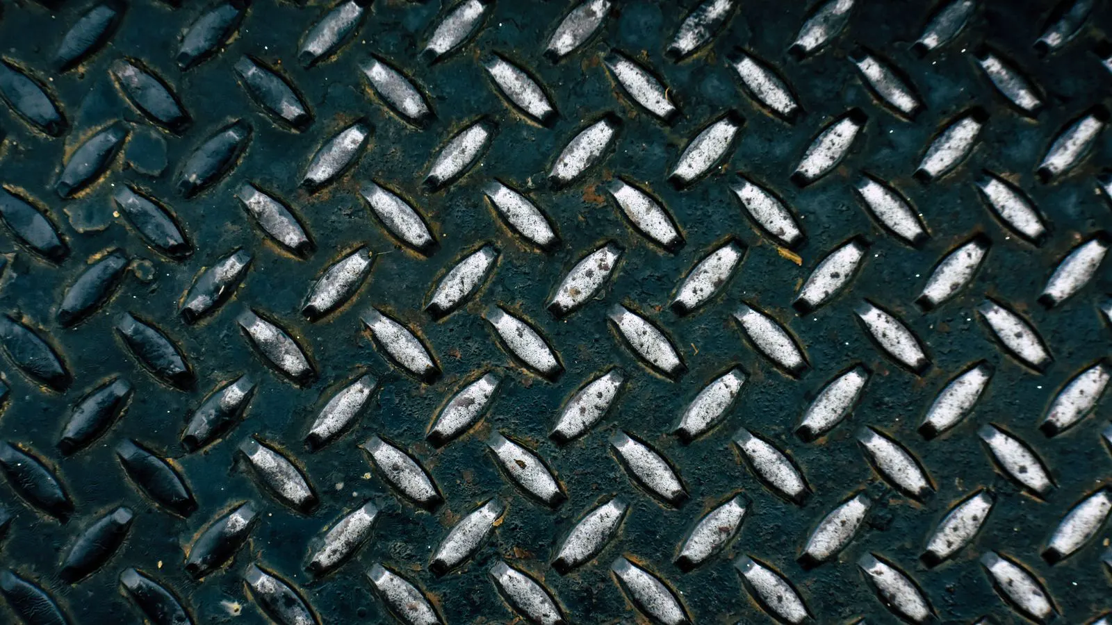 Parts suspended inside a large electrolytic plating tank