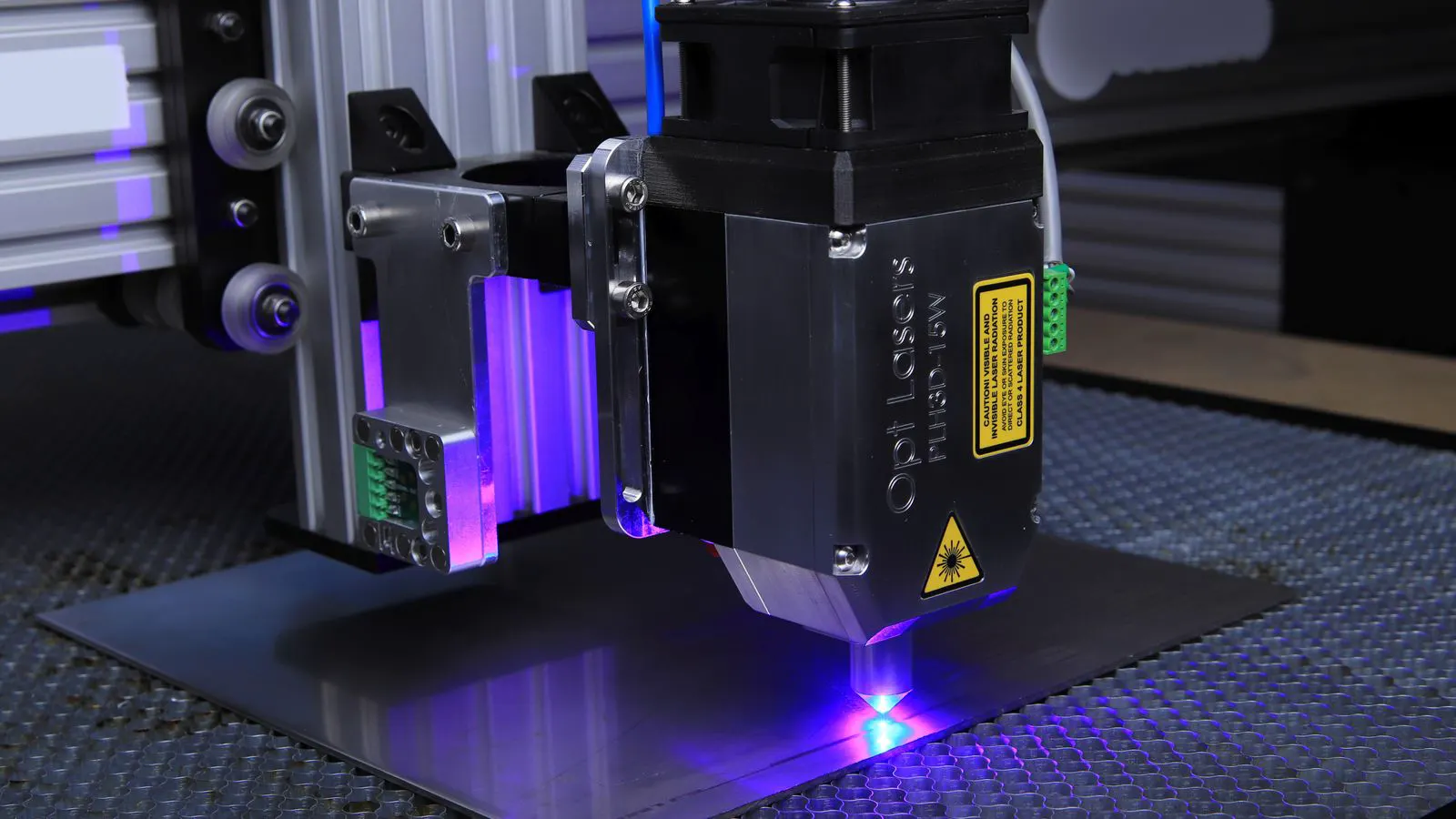 A precision metal component undergoing laser polishing