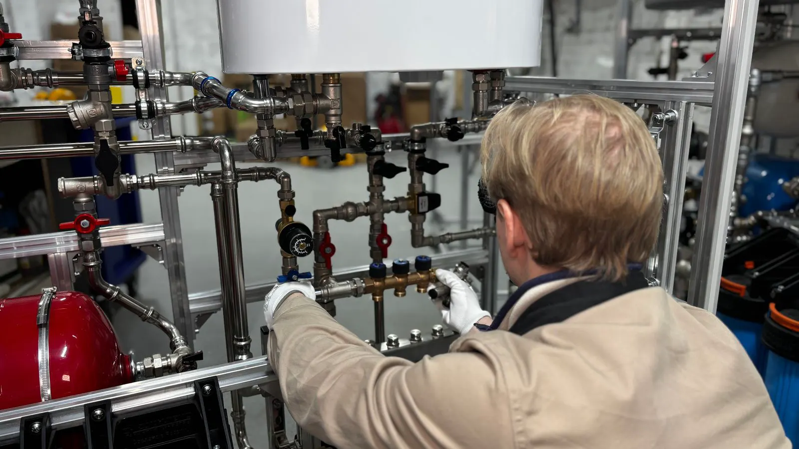 A stainless steel flow meter installed in a process pipe