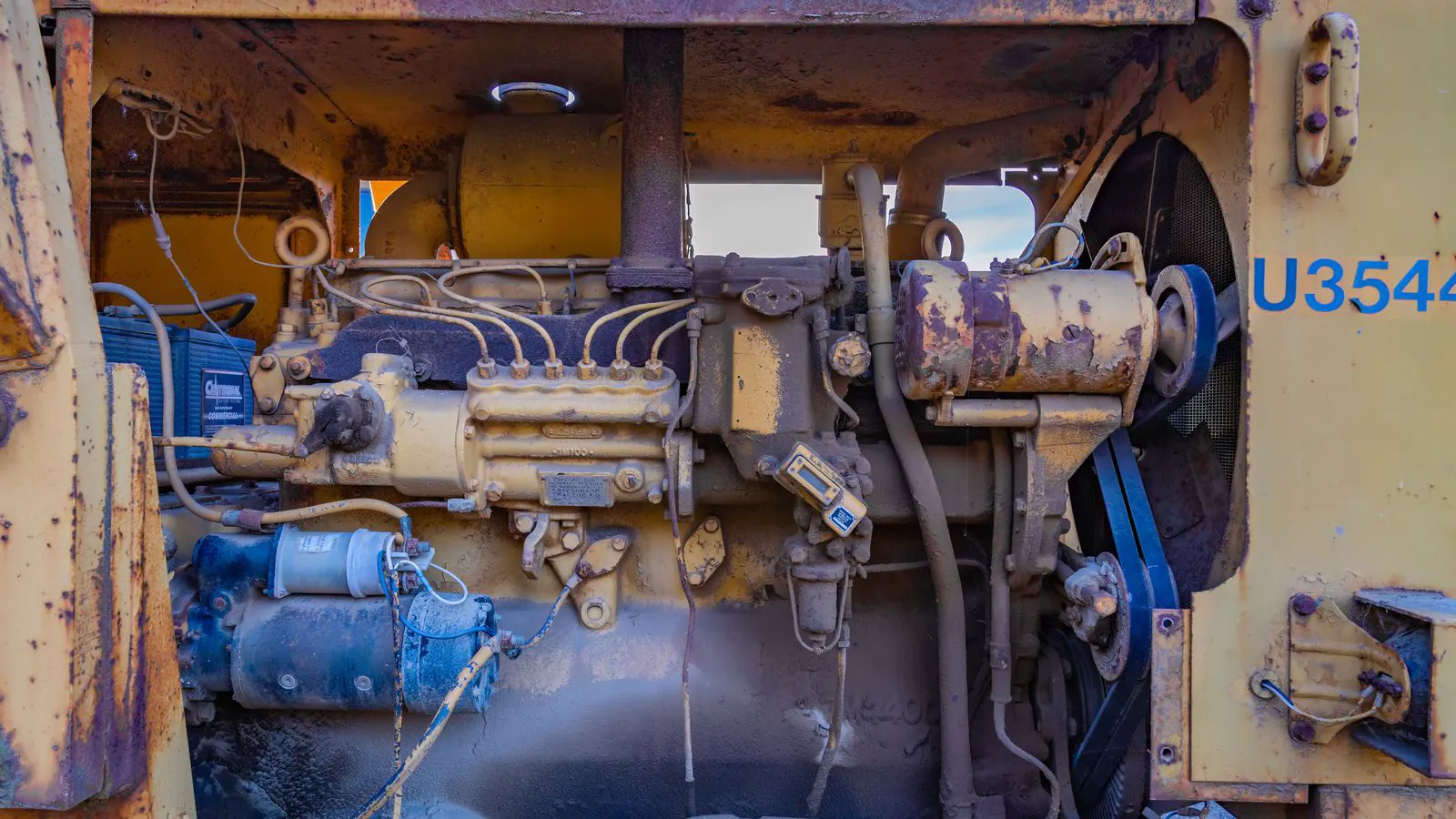 A clipboard with a load calculation checklist near an industrial generator.