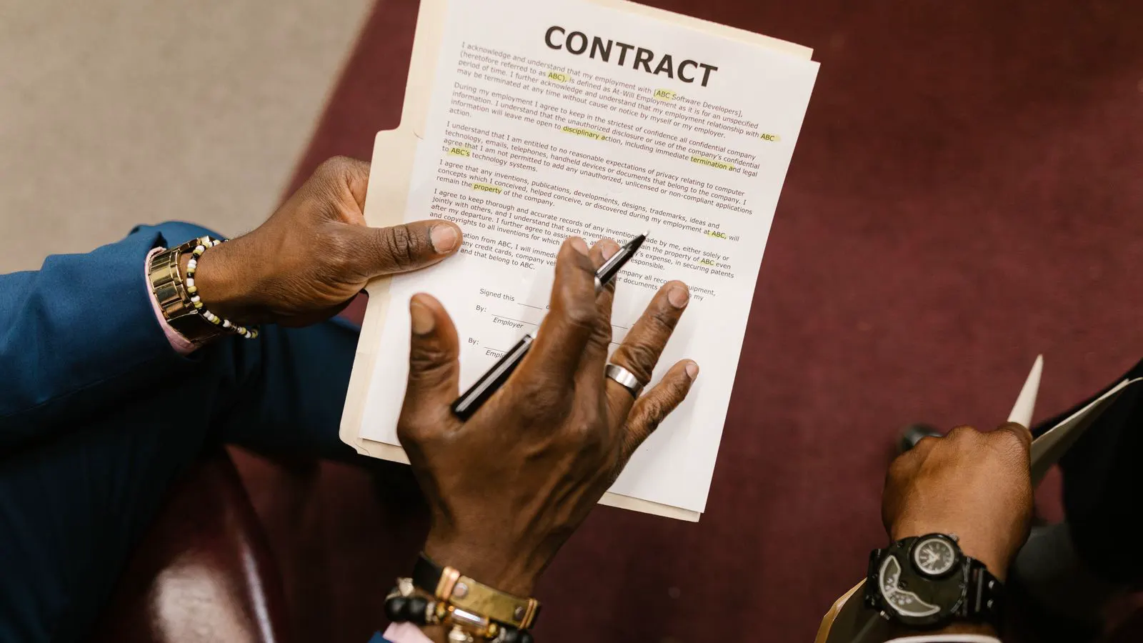 Engineer reviewing a service contract document at a desk