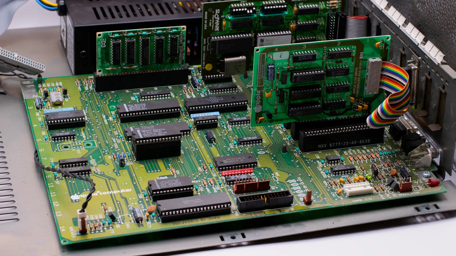Close-up view of a small circuit board with dense passive components