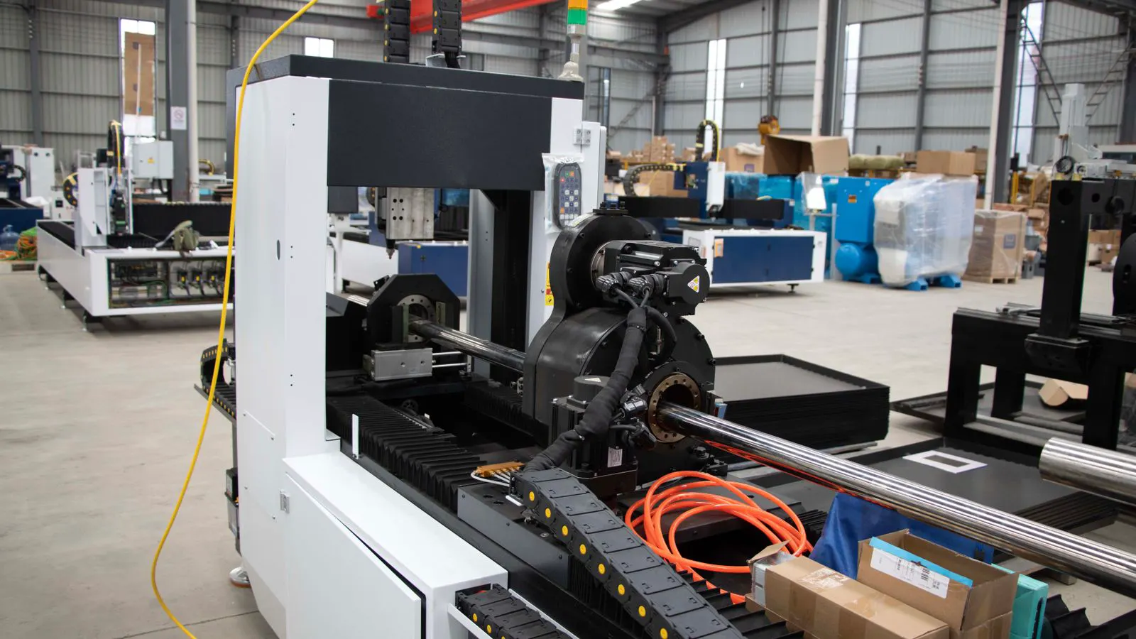 A technician operating an automated wire harness testing machine