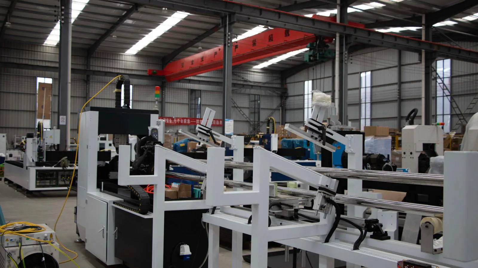 Robotic arms assembling wire harnesses on a production line