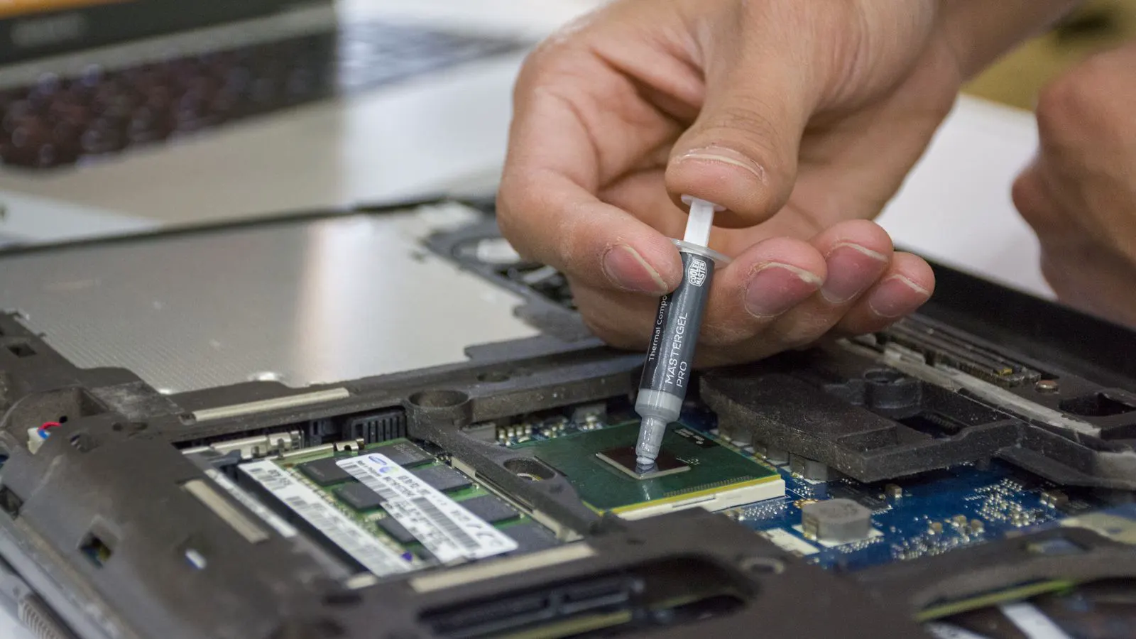 Engineer checking temperature on a rack power supply unit