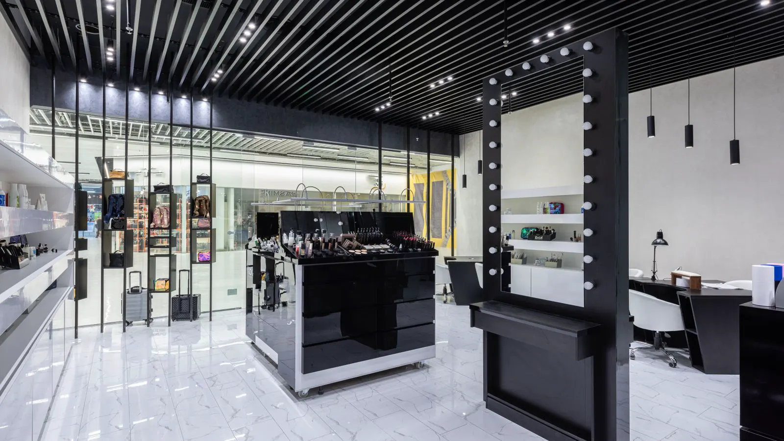 Row of LED high bay fixtures in a retail ceiling