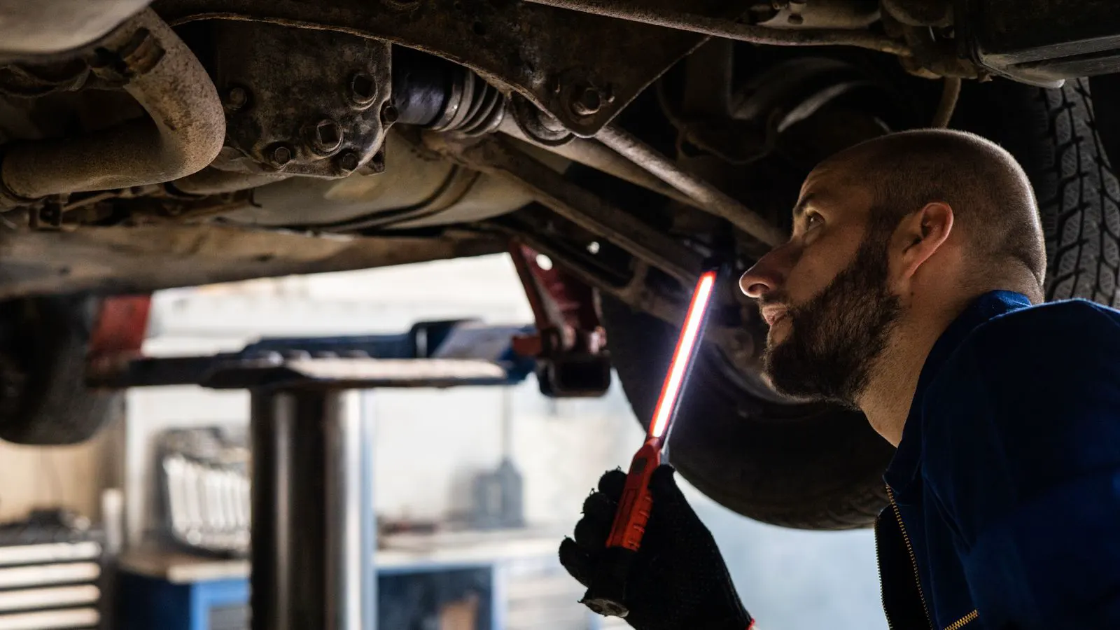 A technician uses a multimeter to test a street light driver.