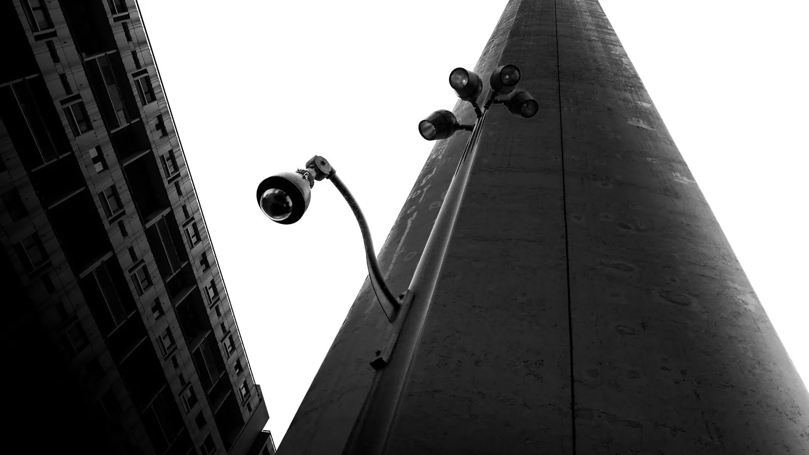 A single security camera mounted on a metal pole