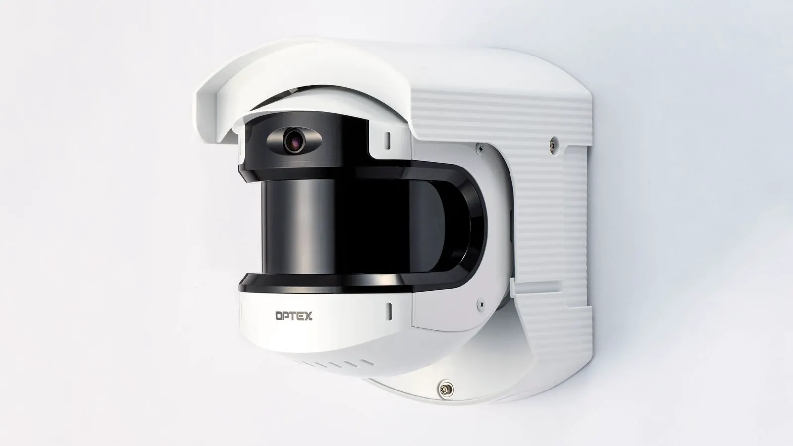 A single analog security camera mounted on an exterior wall