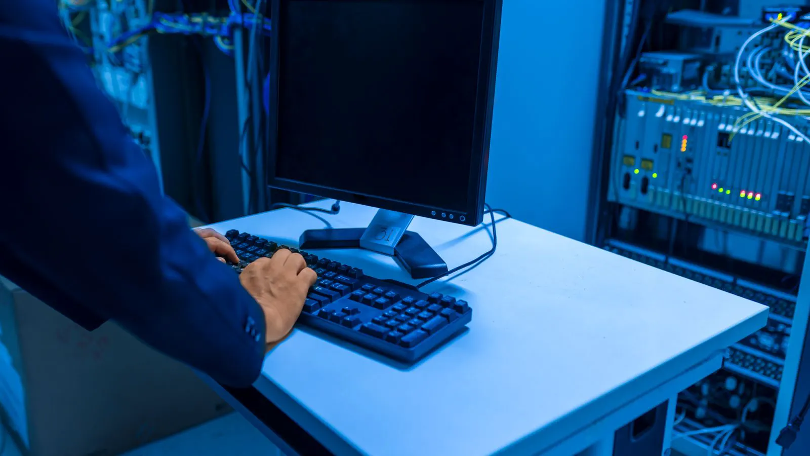 A rack-mounted video server with network cables and status lights