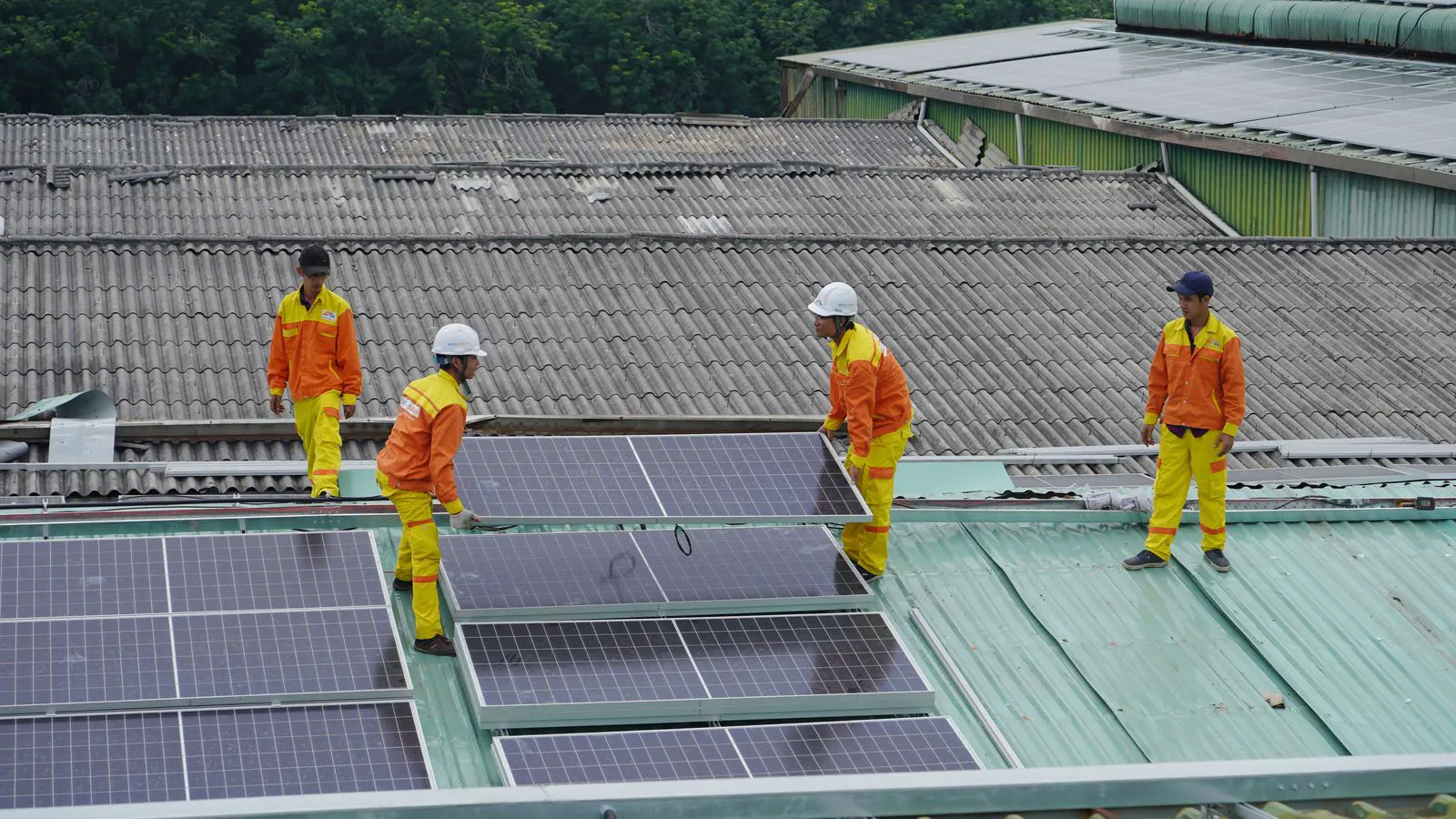 Two different types of solar panels installed on a roof