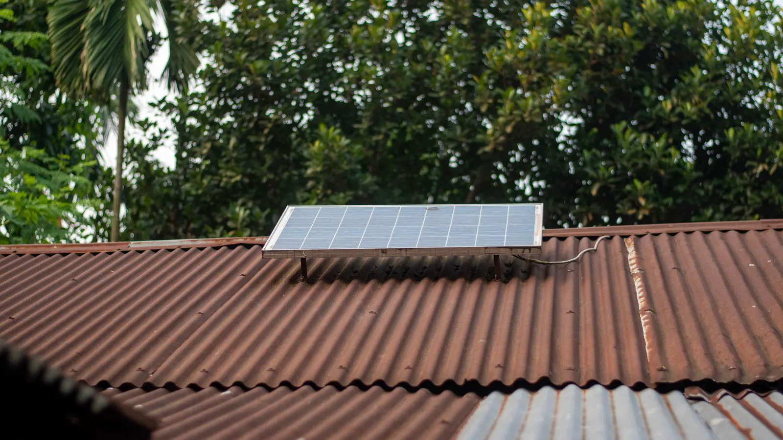 Steel mounting rails attached to a sloped roof surface