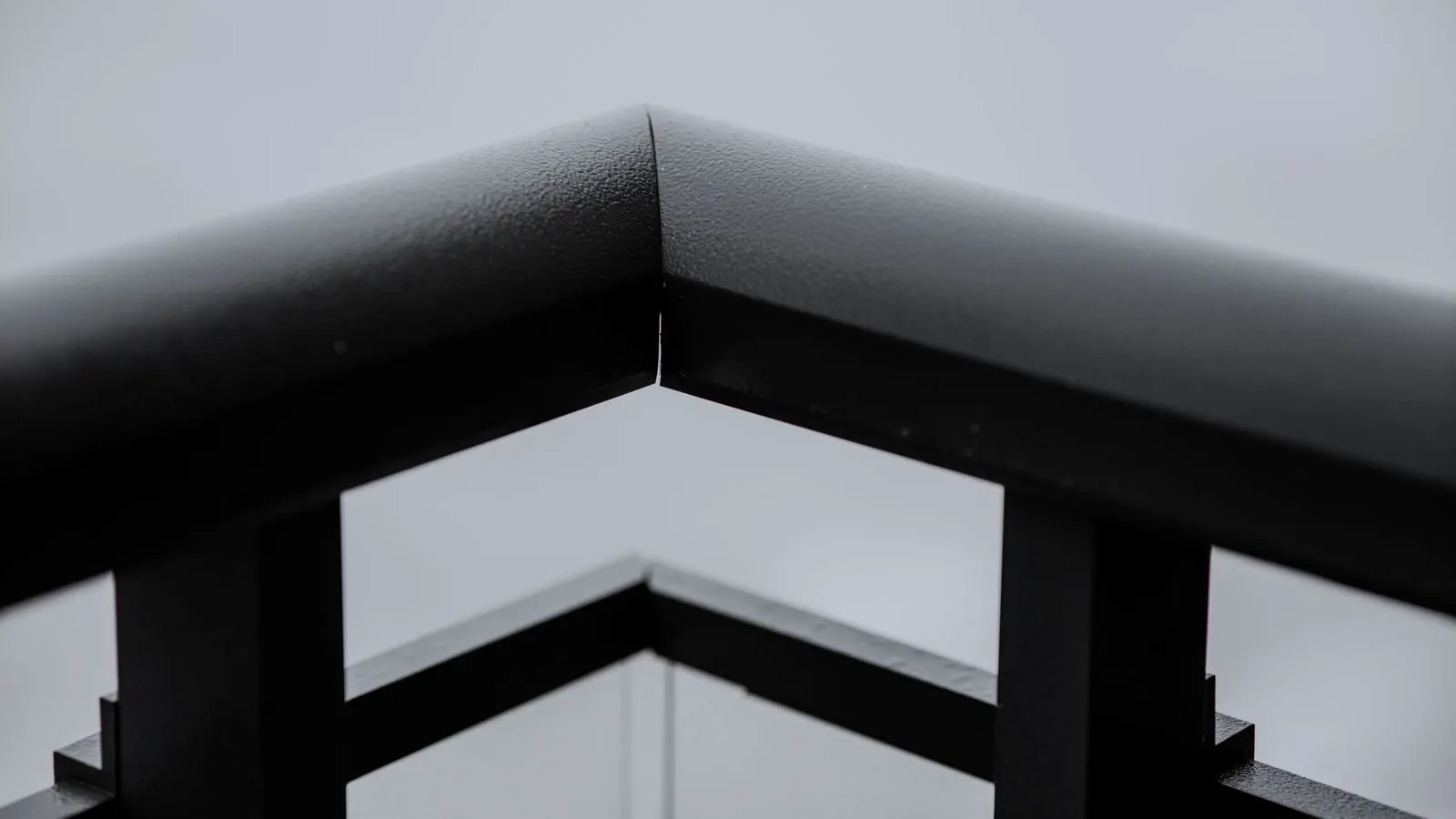 A detailed view of a galvanized steel racking joint with visible zinc coating