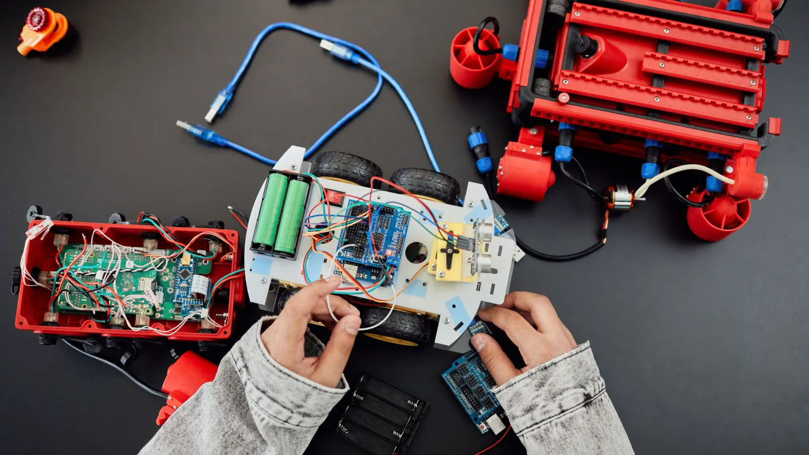 Close-up view of a lithium battery pack with cooling plates and wiring