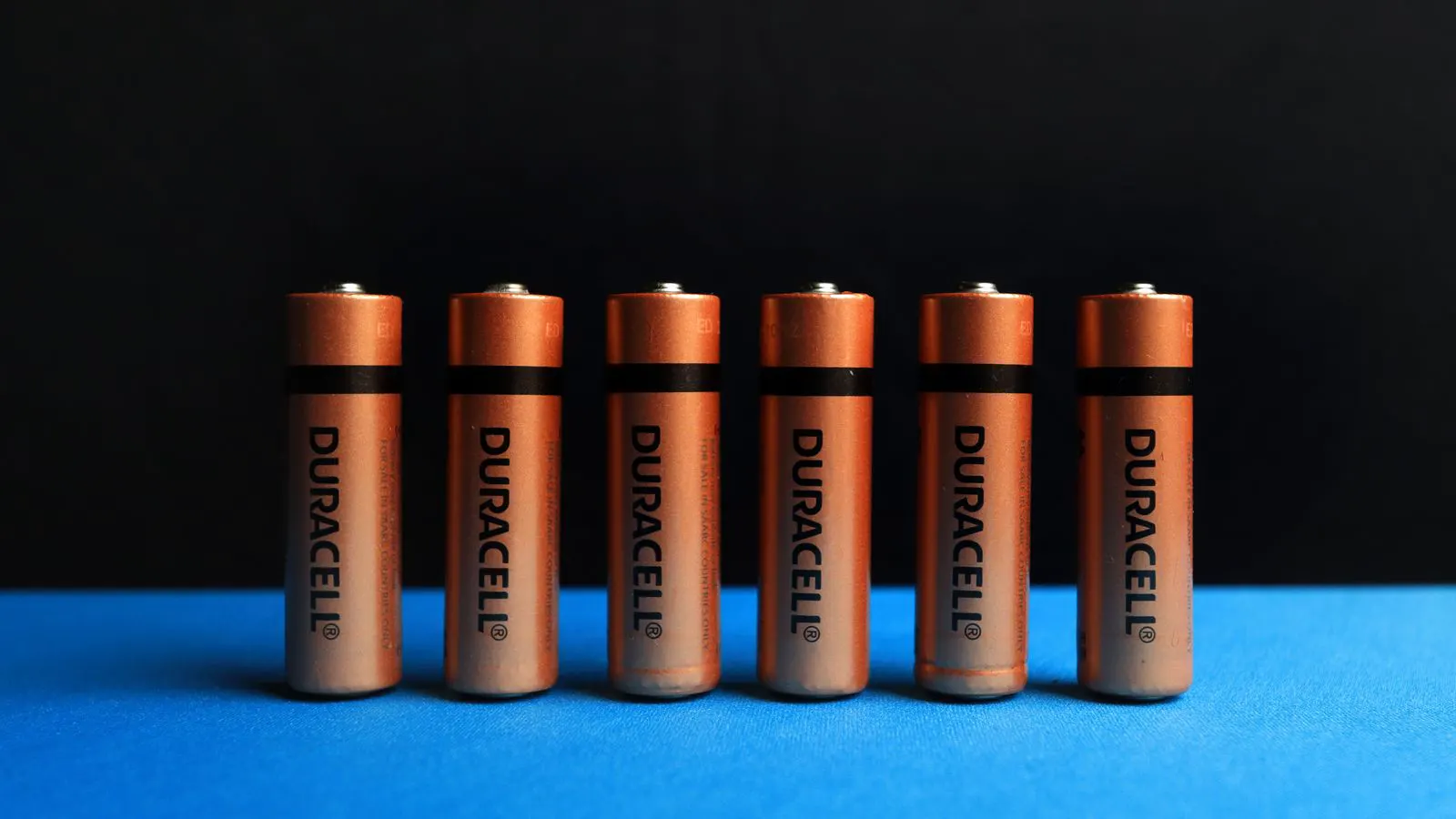 Rows of cylindrical lithium battery cells on a production line