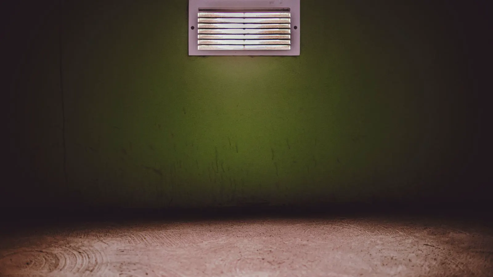 Industrial battery storage units in a clean room with visible ventilation ducts.