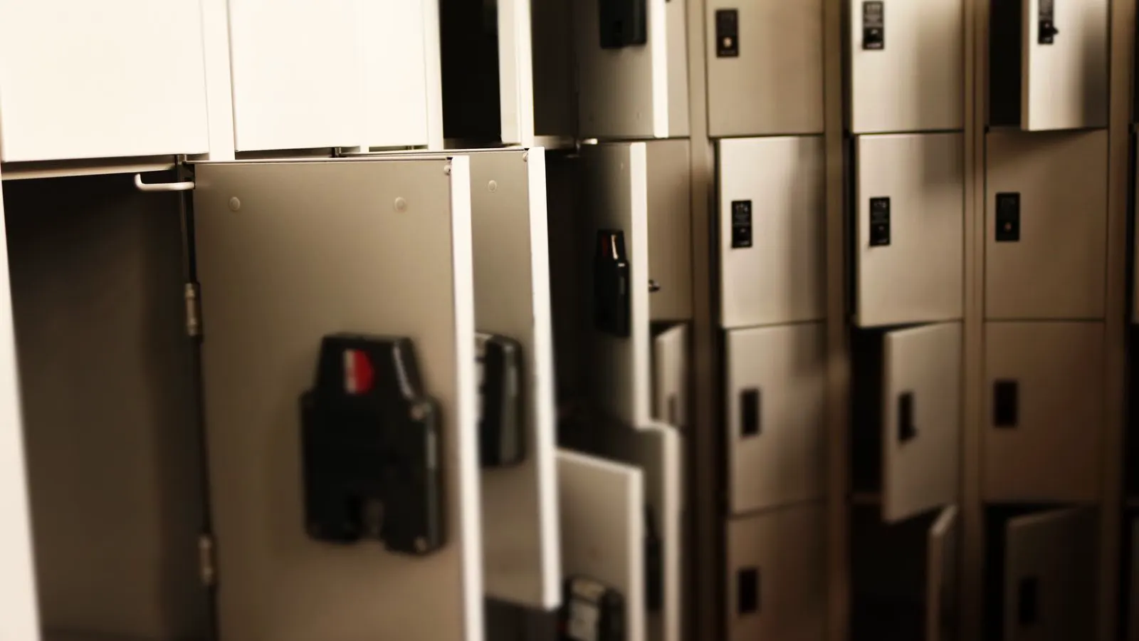 Technician inspecting battery modules during pre-handover audit